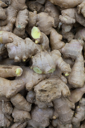 heap of ginger root Ginger background A bunch of ginger on the counter of a vegetable supermarket for sale top view