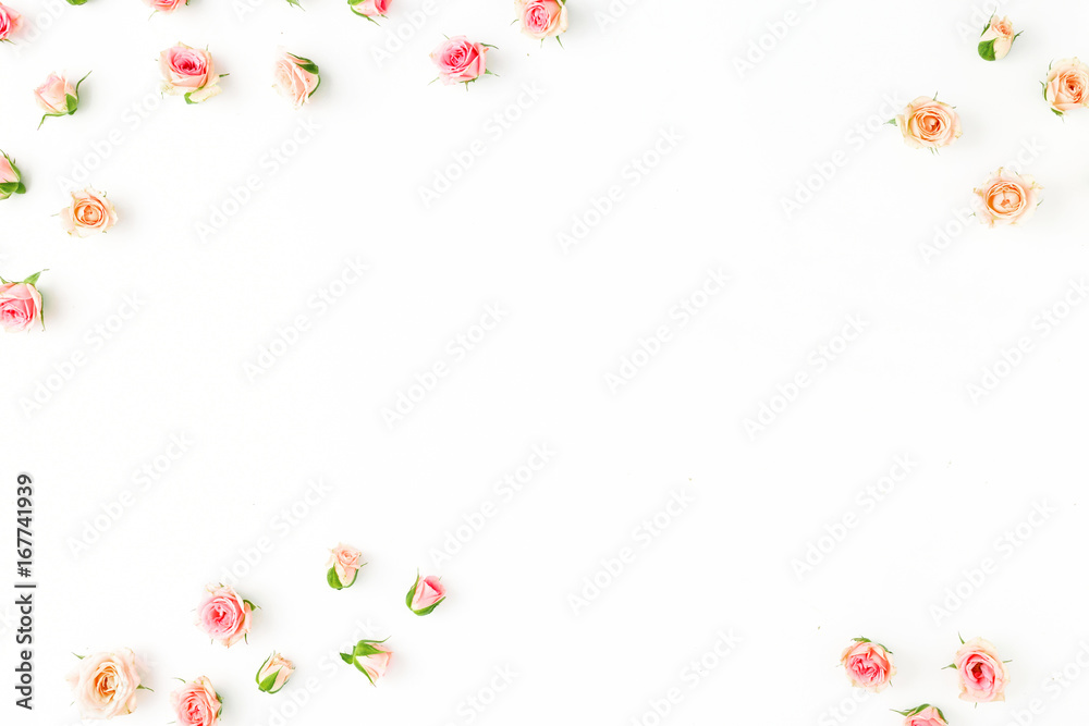 Frame of pink roses on a white background. Flat lay