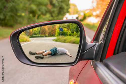 Rearview mirror with a man hit by a car © andriano_cz