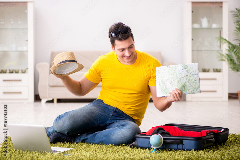 Man planning his vacation trip with map Man planning his vacation trip with map