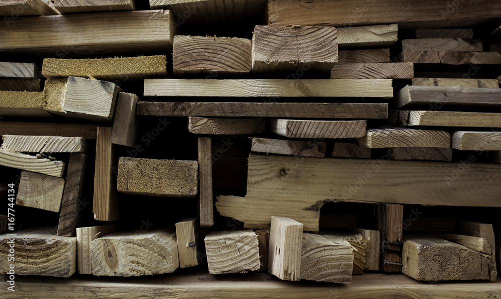 Wood stacked neatly in geometric pattern. Wood stacked neatly in geometric pattern.