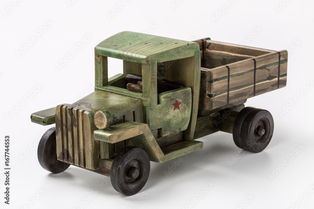 Vintage green truck toy car made of wood.