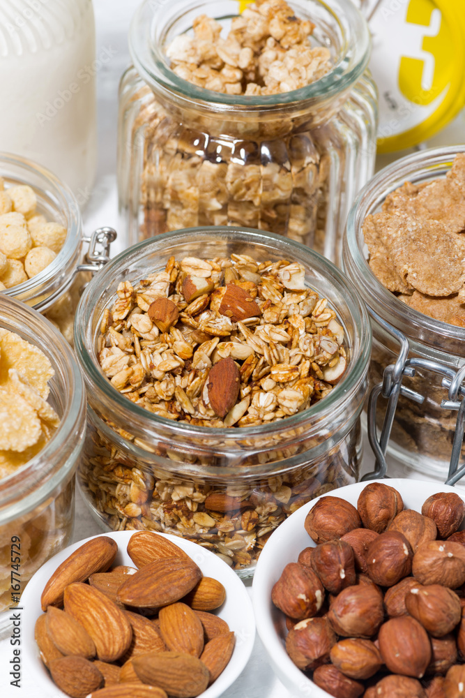 assortment of breakfast cereals and nuts, vertical assortment of breakfast cereals and nuts, vertical