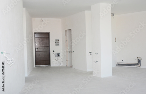 Empty room interior build with plastering wall, drywalls, stucco, metal door, wireless.