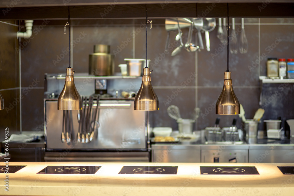 Restaurant kitchen interior bar counter made of natural stone, fences off the open kitchen and