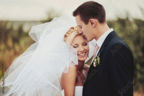 Beautiful bride and groom couple walking at the wedding