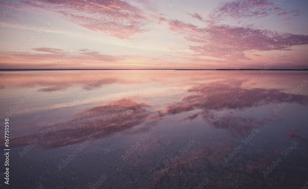 Fototapeta premium Colorful beautiful sunset over ocean surface