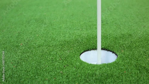 Golfer on the green misses a close putt