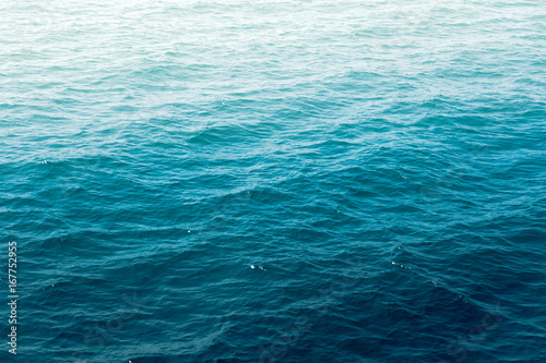 Deep blue sea water wave suface with sun reflection. © AePatt Journey