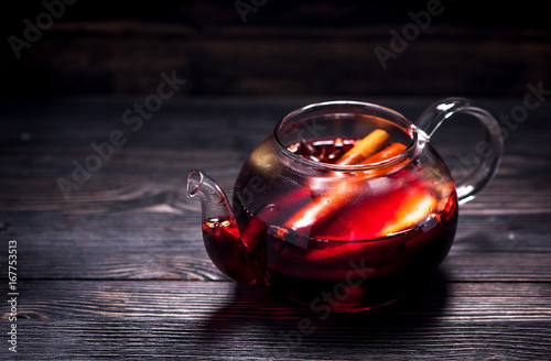 Hot wine mulled wine in a glass teapot