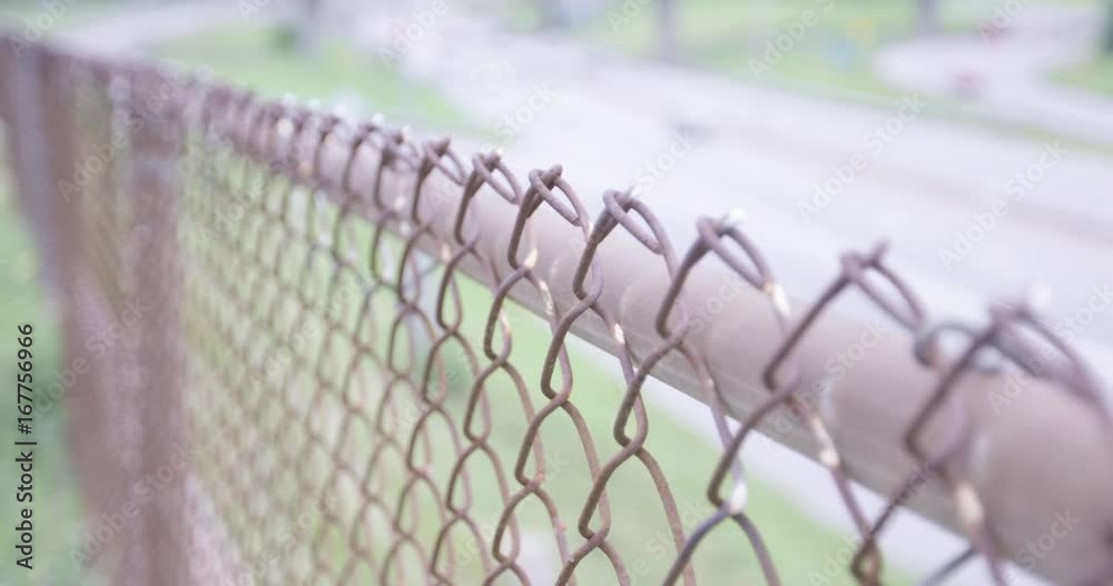 Rusted chain link fence in summer - slow motion Rusted chain link fence in summer - slow motion