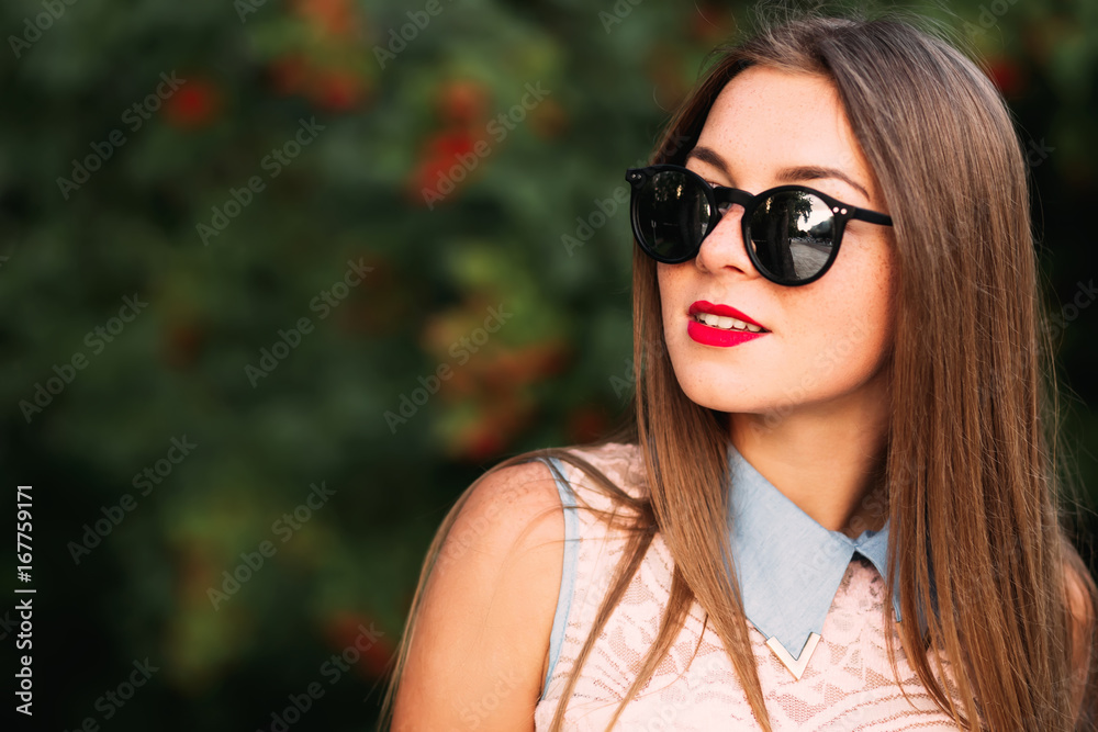 Portrait of beautiful smiling young woman with long hair with su Portrait of beautiful smiling young woman with long hair with su