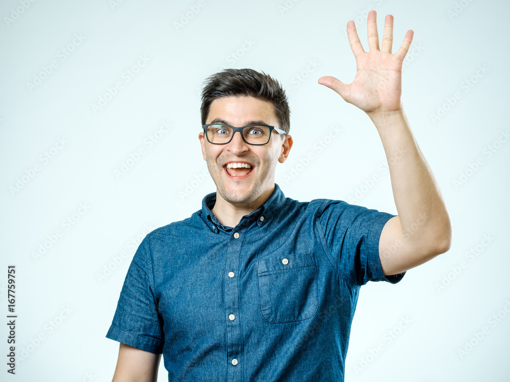 Naklejka premium Young man making high five gesture