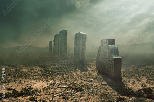 Tombstone and graves in an ancient church graveyard, halloween concept 