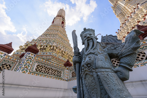 Giant statue in Wat Arun Ratchawararam Ratchawaramahawihan in Thailnd photo