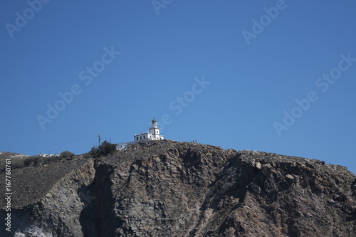 Lighthouse on top of a Cliff