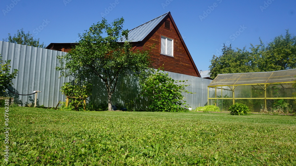 Obraz premium Russia Countryside Cabin and garden