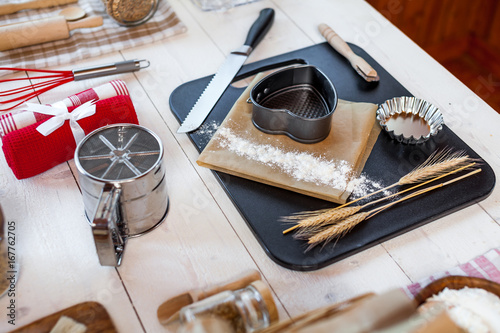 Bakery utensils. Kitchen tools for baking on a rustic wooden table.
