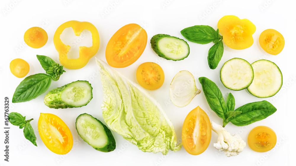 Set of slices of vegetables of yellow and green color isolated on white background top view, design for vegetable menu. Tomato onion cucumber sweet pepper zucchini Peking cabbage cauliflower basil. Set of slices of vegetables of yellow and green color isolated on white background top view, design for vegetable menu. Tomato onion cucumber sweet pepper zucchini Peking cabbage cauliflower basil.
