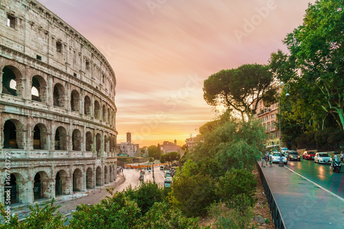 Back view on colosseum at sunset time. 