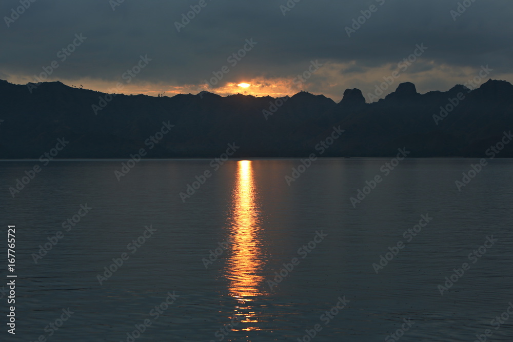 Sunset around the beautiful komodo island inside of national park in indonesia, home of the komodo dragon, unique ecosystem and great adventure, nature habitat, travel and enjoy asia 