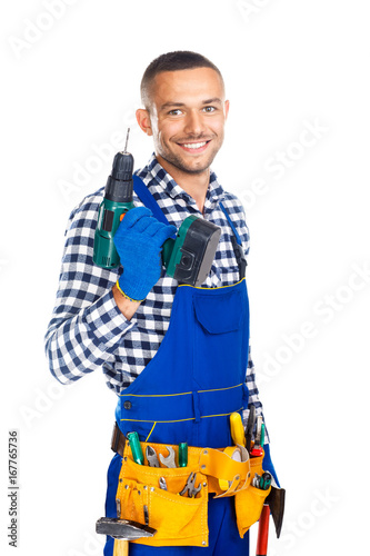 Happy smiling construction worker with drill and tool belt