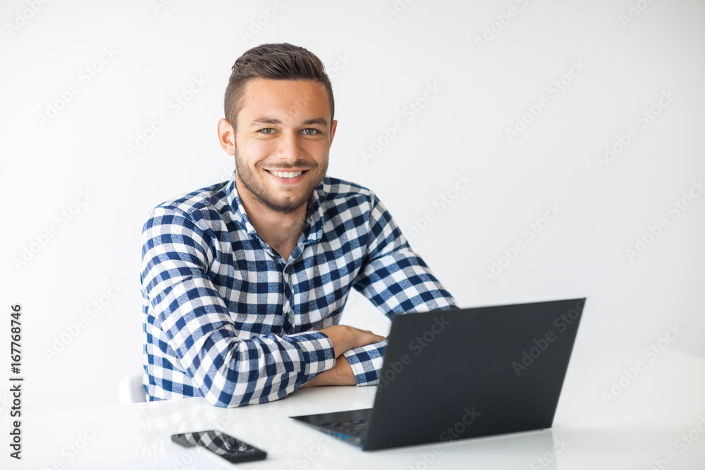 Portrait of handsome smiling man with laptop Portrait of handsome smiling man with laptop