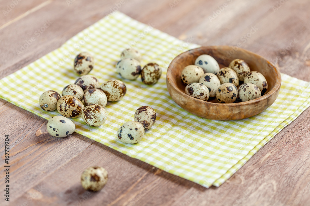 Quail eggs on the old rustic wooden table. Quail eggs on the old rustic wooden table.