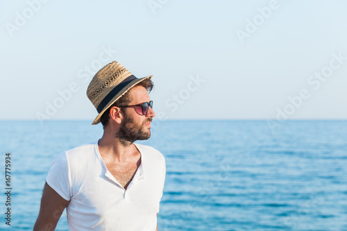 Young hipster man on the beach © marjan4782