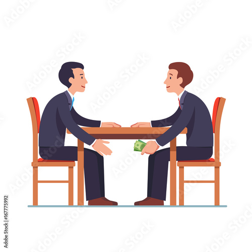 Businessman passing money under table to partner