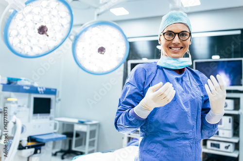 Happy woman surgeon ready for operation photo
