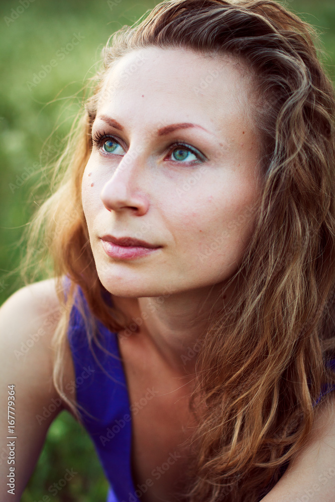 Beautiful young pretty woman with curly fair hair outdoors portrait. Close up Beautiful young pretty woman with curly fair hair outdoors portrait. Close up