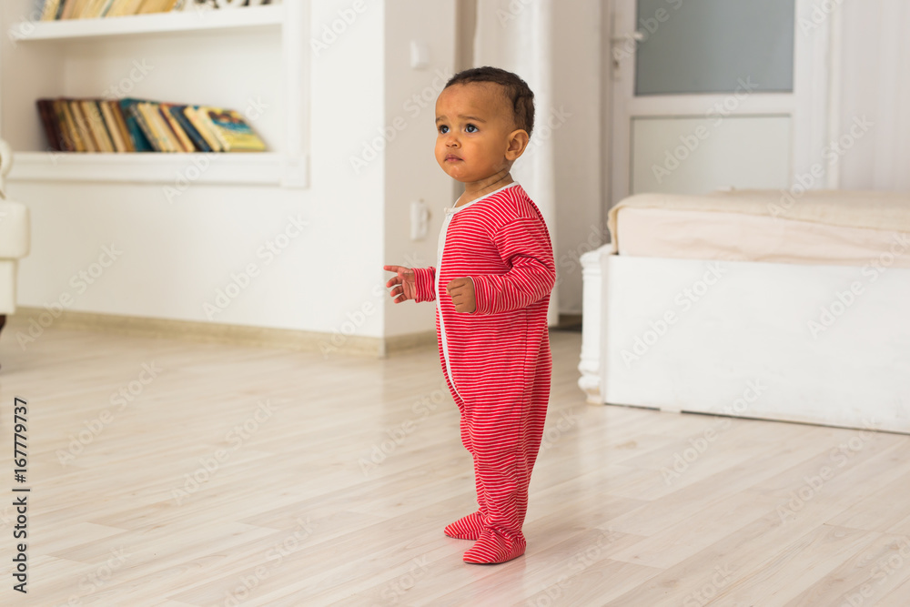 Full length portrait of mixed race baby boy in the home Full length portrait of mixed race baby boy in the home