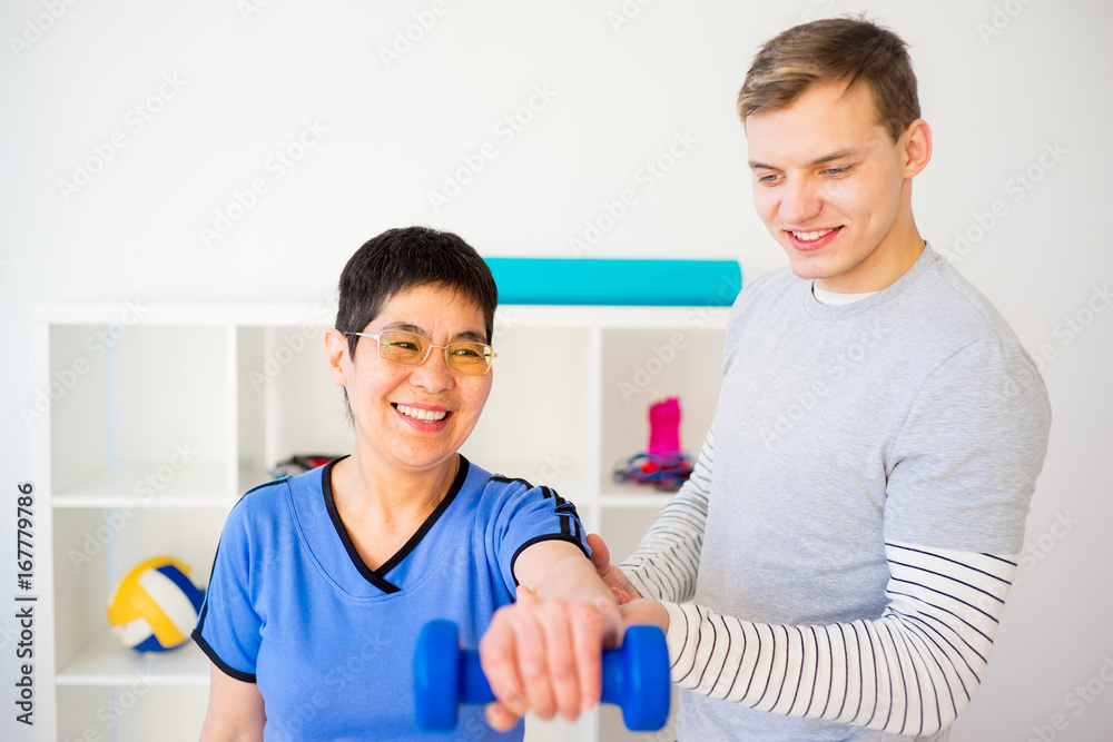 Physiotherapist working with patient Physiotherapist working with patient