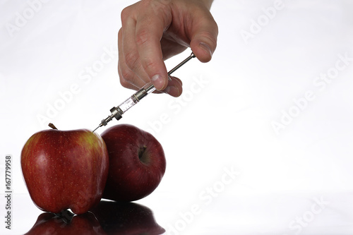 Genetically modified foods, apple pumped with chemicals