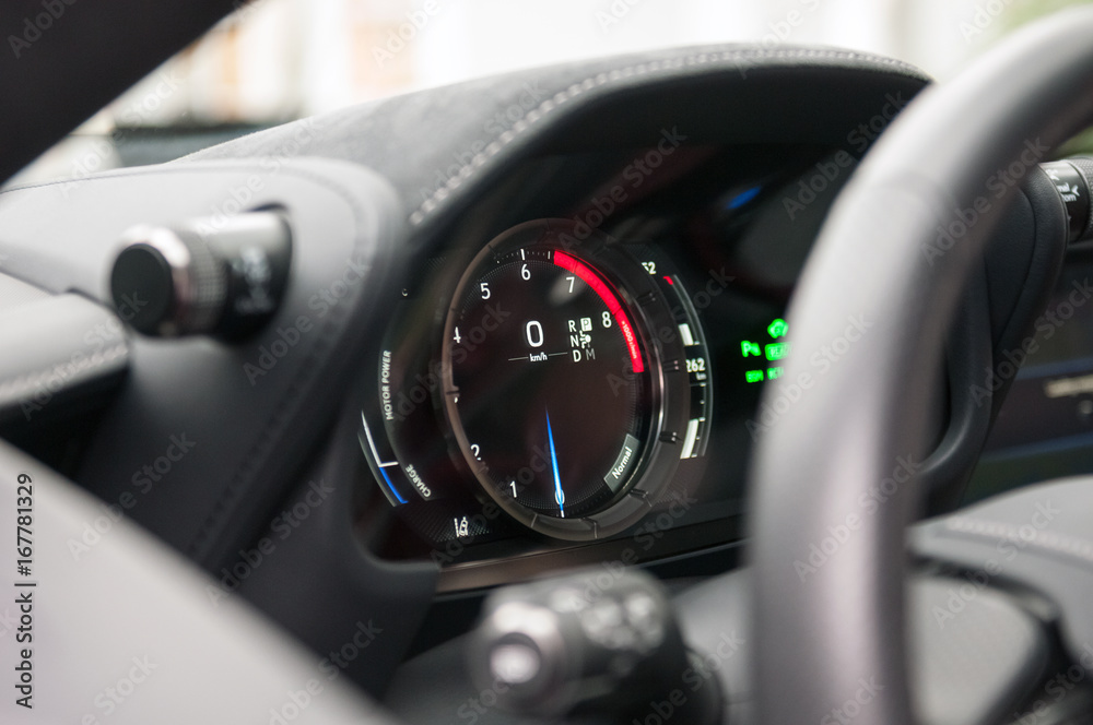 Tachometer and speedometer in the new sports car.