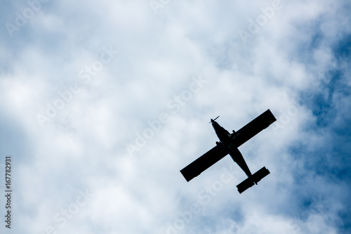 airplane flying in cloudy sky, Bottom view angle of air plane flying in the sky, Retro style airplane