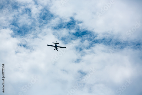 airplane flying in cloudy sky  Bottom view angle of air plane flying in the sky  Retro style airplane