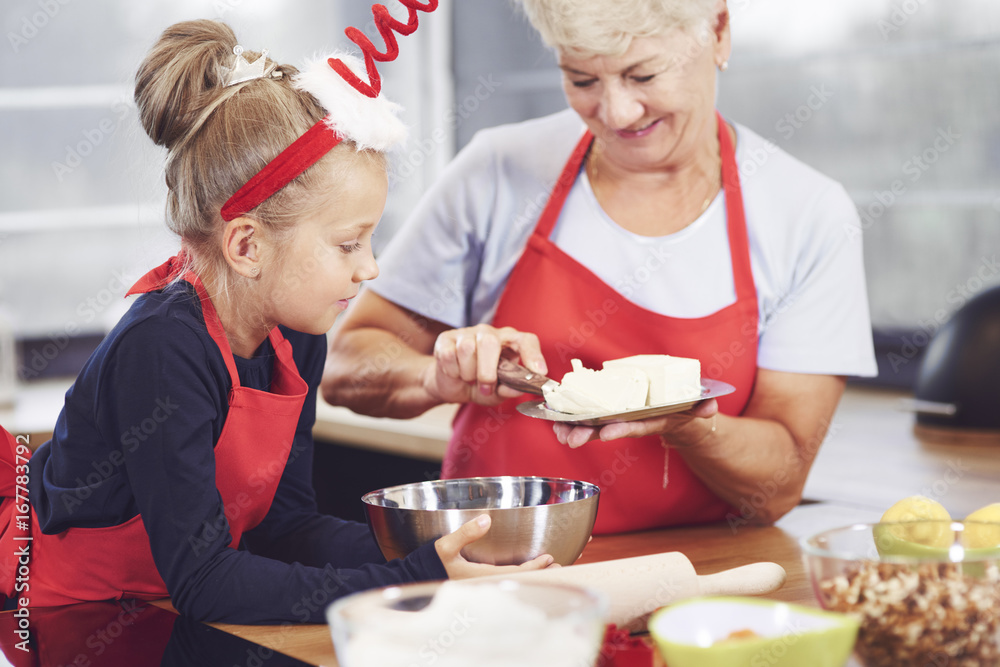 Grandmother and granddaughter cooking in the kitchen. Grandmother and granddaughter cooking in the kitchen.