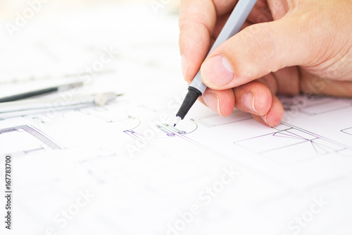 architect working drawing construction plans