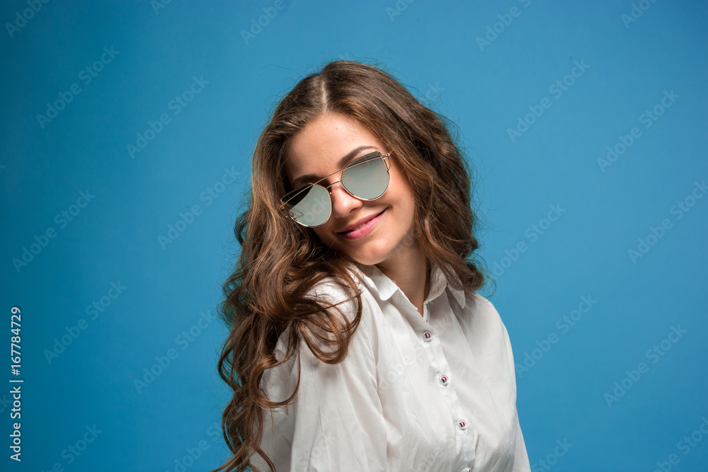 The young woman's portrait with happy emotions The young woman's portrait with happy emotions