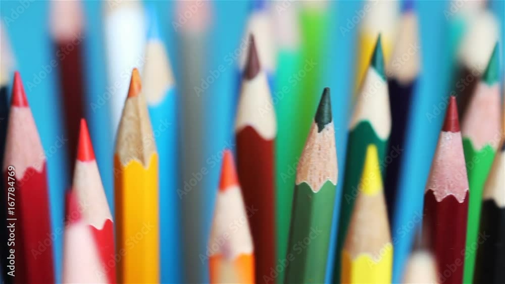 Rotating pencils on a blue background Rotating pencils on a blue background