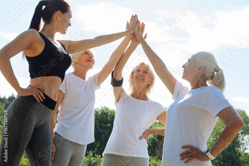 Group of sporty females standing in circle