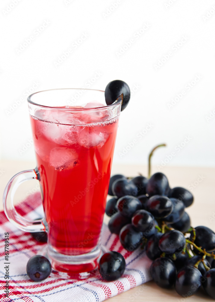 Fruit juice with ice in a glass, a bunch of grapes Fruit juice with ice in a glass, a bunch of grapes