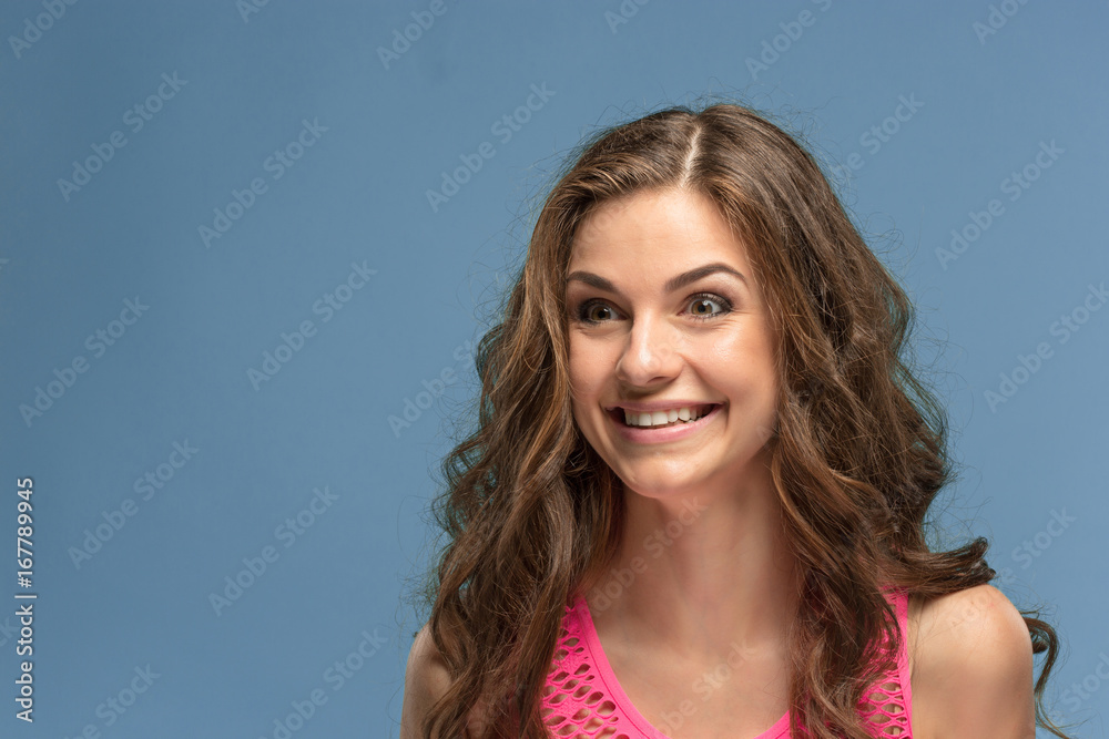 The young woman's portrait with happy emotions The young woman's portrait with happy emotions