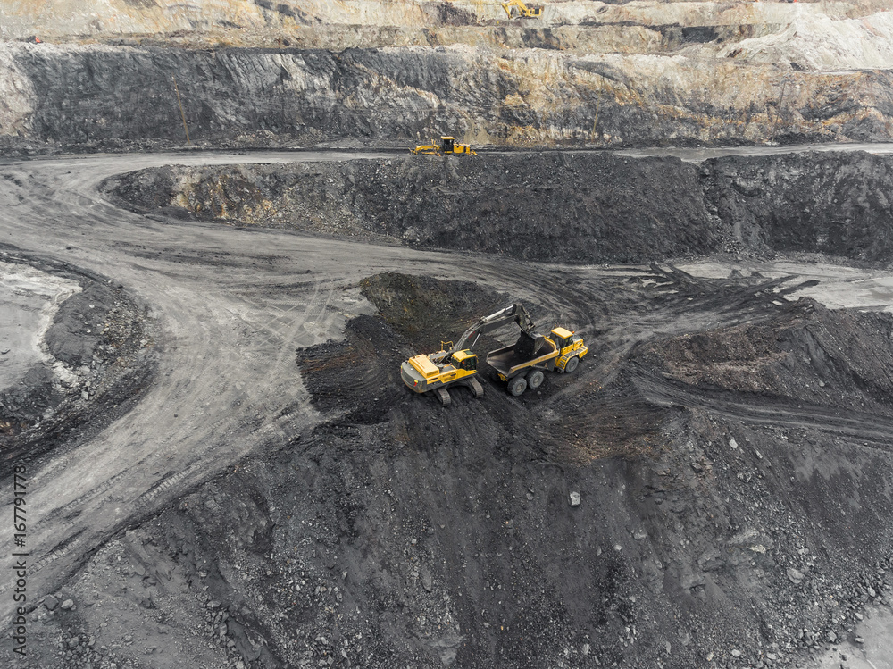 Aerial view open pit mine, loading of rock, mining coal, extractive industry Aerial view open pit mine, loading of rock, mining coal, extractive industry