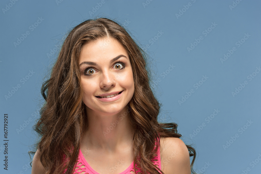 Portrait of young woman with shocked facial expression Portrait of young woman with shocked facial expression