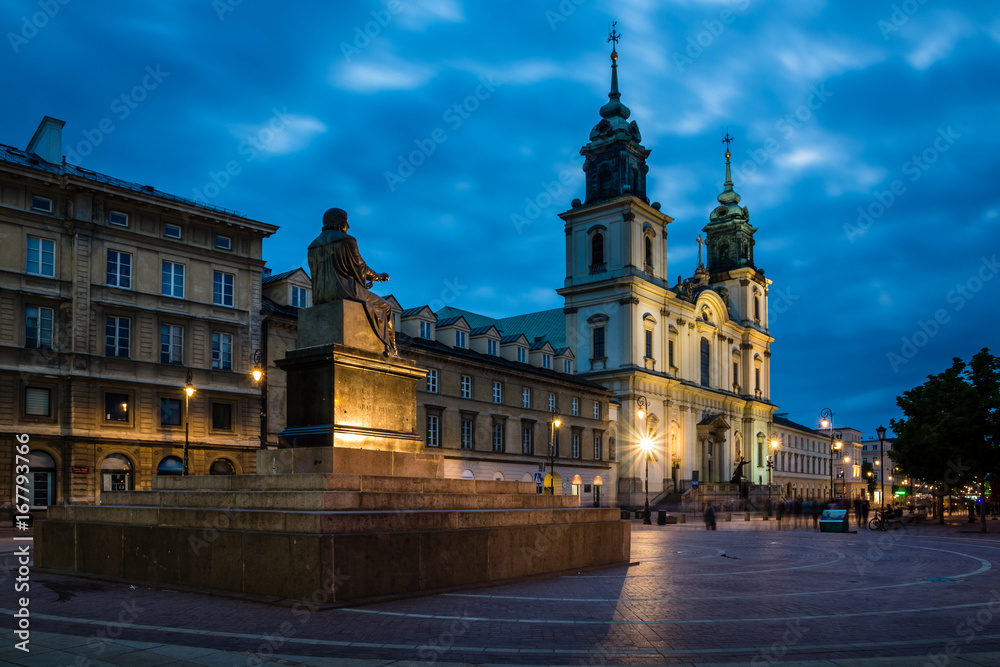 Church of the Holy Cross at night in Warsaw, Poland