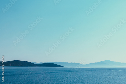 Mountain chain across the seashore of Aegean Sea in Greece © diignat
