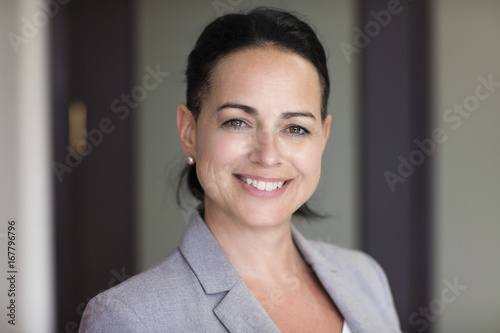 Mature Businesswoman Smiling At The Camera. Working At Home. Free Download Mature Businesswoman Smiling At The Camera. Working At Home. - GFXLoad